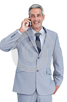 Happy businessman answering phone