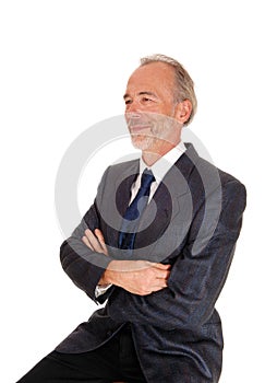 Happy businessman with arms grossed. photo