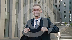 Happy businessman dancing joyfully, successful career, profitable investment. Crazy funny male manager in formal suit