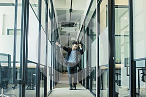 Happy businessman dancing in the office