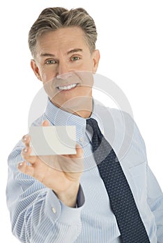 Happy Businessman Displaying Blank Business Card