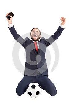 Happy businessman with football