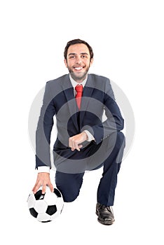 Happy businessman with football