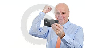 Happy Businessman Gesticulate Astonished Reading Financial Good News on Mobile