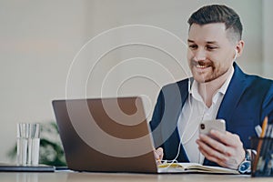 Happy businessman having video conference call while working at office