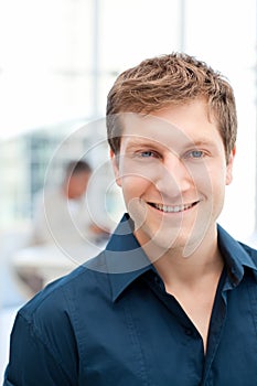 Happy businessman in his office