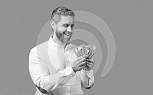 happy businessman hold money earning. photo of businessman holding earning money.