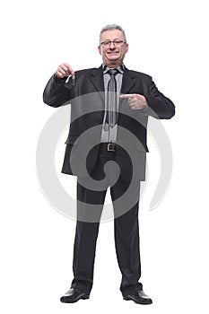 Happy businessman holding the keys and looking at camera