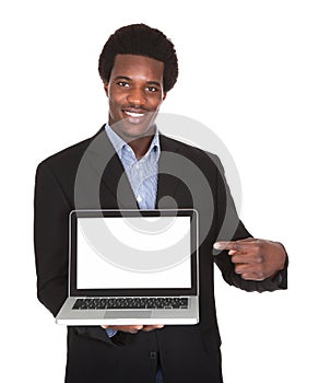 Happy Businessman Holding Laptop