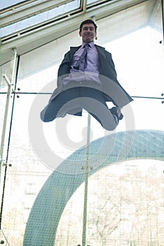 Happy businessman jumping