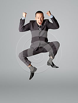 Happy businessman jumping