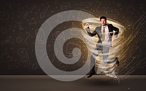 Happy businessman jumping in tornado concept