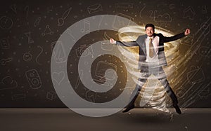 Happy businessman jumping in tornado concept