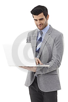 Happy businessman with laptop computer