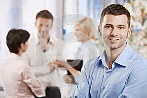 Happy businessman in office