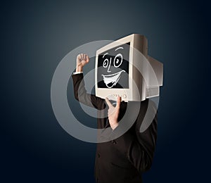 Happy businessman with a PC monitor head and a smiley face