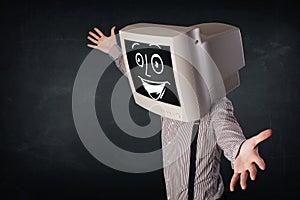 Happy businessman with a PC monitor head and a smiley face