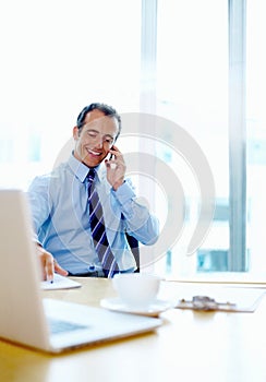 Happy businessman, phone call and discussion at office for communication, proposal or networking. Man or employee smile