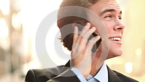 Happy businessman, phone call and laughing for funny joke, discussion or communication on a bokeh background. Face of