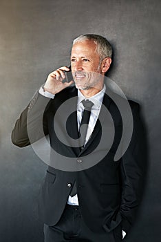 Happy businessman, phone call and thinking with communication, contact and network in studio. A senior entrepreneur