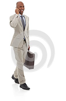 Happy businessman, phone call and walking with suitcase for discussion on a white studio background. Black man or