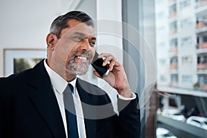 Happy businessman, phone call and window in office building for communication, networking and discussion. Boss, CEO and