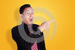 Happy Businessman Pointing To The Side