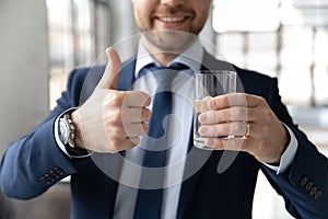 Happy businessman recommending drinking fresh pure water for refreshment