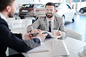 Happy Businessman Renting Car