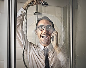 Happy businessman in the shower