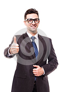 Happy businessman showing his thumb up with smile on white background