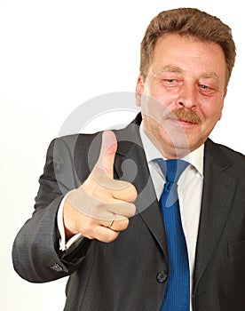 Happy businessman showing his thumb up and smiling