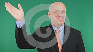 Happy Businessman Smile and Make a Salute Hand Gestures a Welcome Sign.