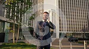 happy businessman speak on smartphone. man boss has conversation. business negotiation.