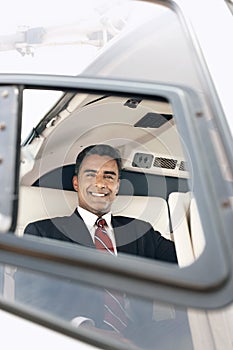 Happy Businessman Travelling Through Helicopter