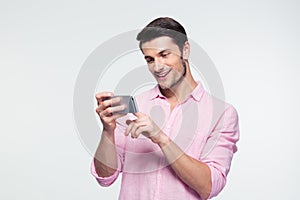 Happy businessman using smartphone