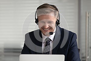 Happy businessman wearing suit wireless headset make conference video call