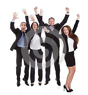 Happy businesspeople jumping in joy