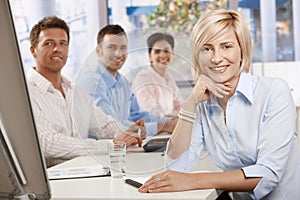 Happy businesswoman in boardroom