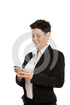 Happy businesswoman with cellphone isolated