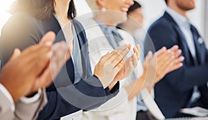 Happy businesswoman clapping hands for presentation during a meeting in an office boardroom with colleagues. Diverse