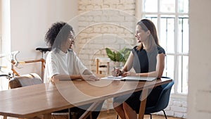 Happy businesswoman hr manager holding interview with job applicant