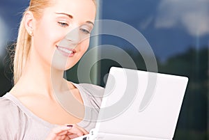 Happy businesswoman with laptop computer