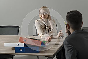 Happy businesswoman and manager at work process. Woman boss with financier in office. Sensual woman discuss company