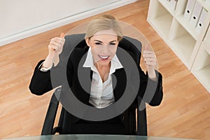 Happy Businesswoman Showing Thumb Up Sign