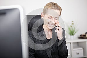 Happy Businesswoman Talking to Someone on Phone