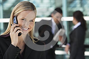 Happy Businesswoman Using Cell Phone