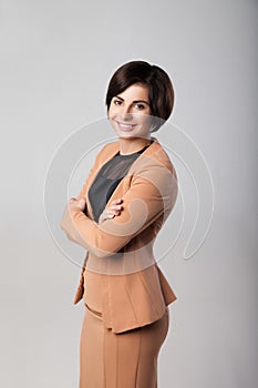 Happy businesswoman wearing suit standing with