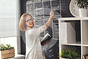 Happy businesswoman woman at school board with schedule planning