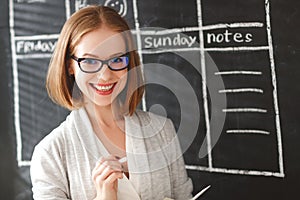 Happy businesswoman woman at school board with schedule planning